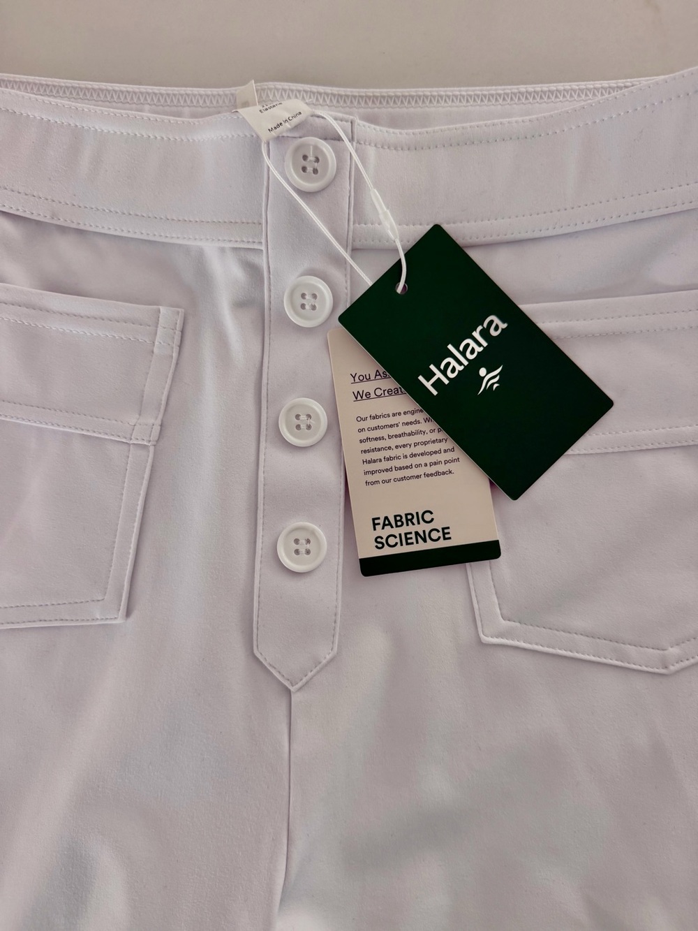 HALARA White Button-Front Active pants with Front Pockets